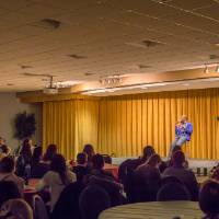 A comedy show in the Grand River Room.